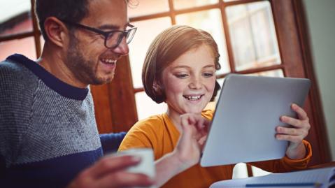 Parent and pupil using iPad